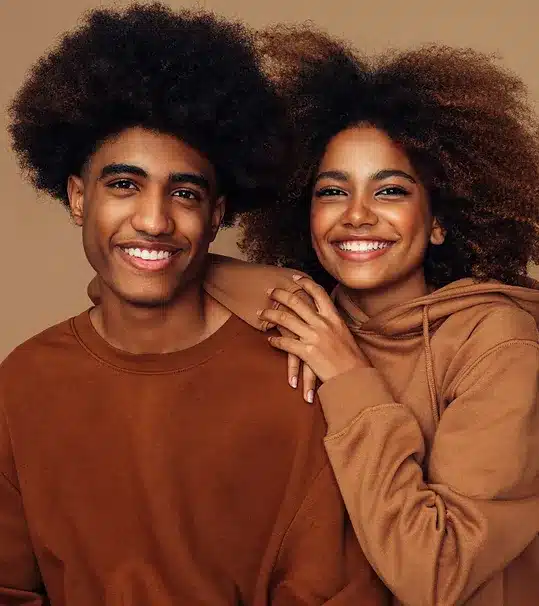 african american man and woman wearing neutral color hoodies