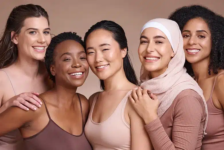 cheerful multi ethnic women showing variations in their skin